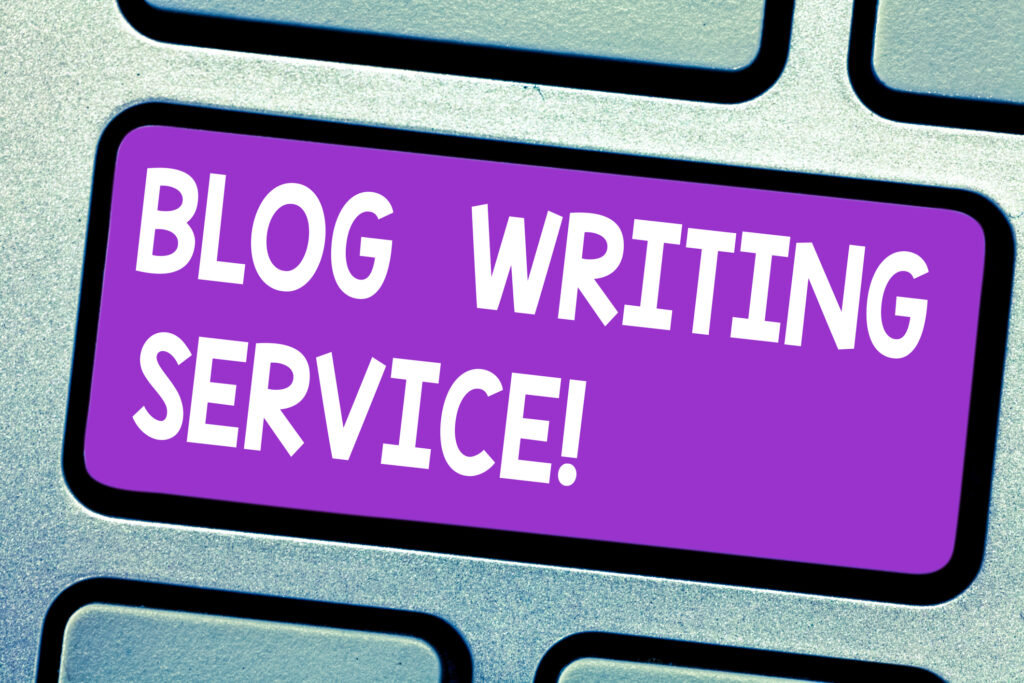 Zoomed in image of Keyboard with one key that has blog writing service written on it. Blog Writing Service.