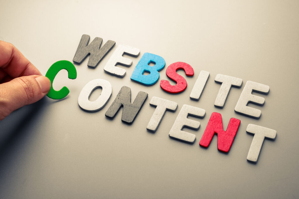 Man putting together block letters of different colours to spell website content as part of website design